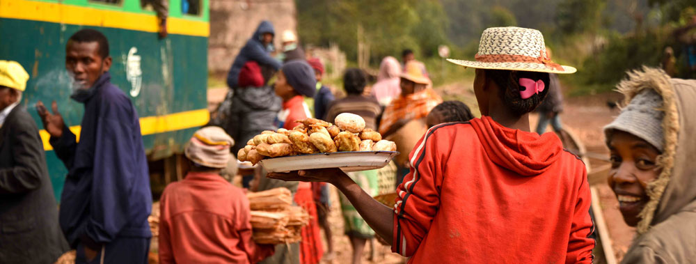 Traditional Malagasy cuisine includes a lot of street food, like the mofo being sold in this photo